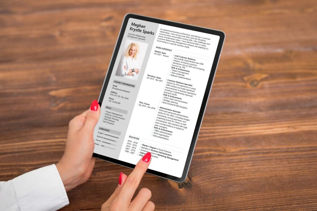 woman looking cv document on tablet